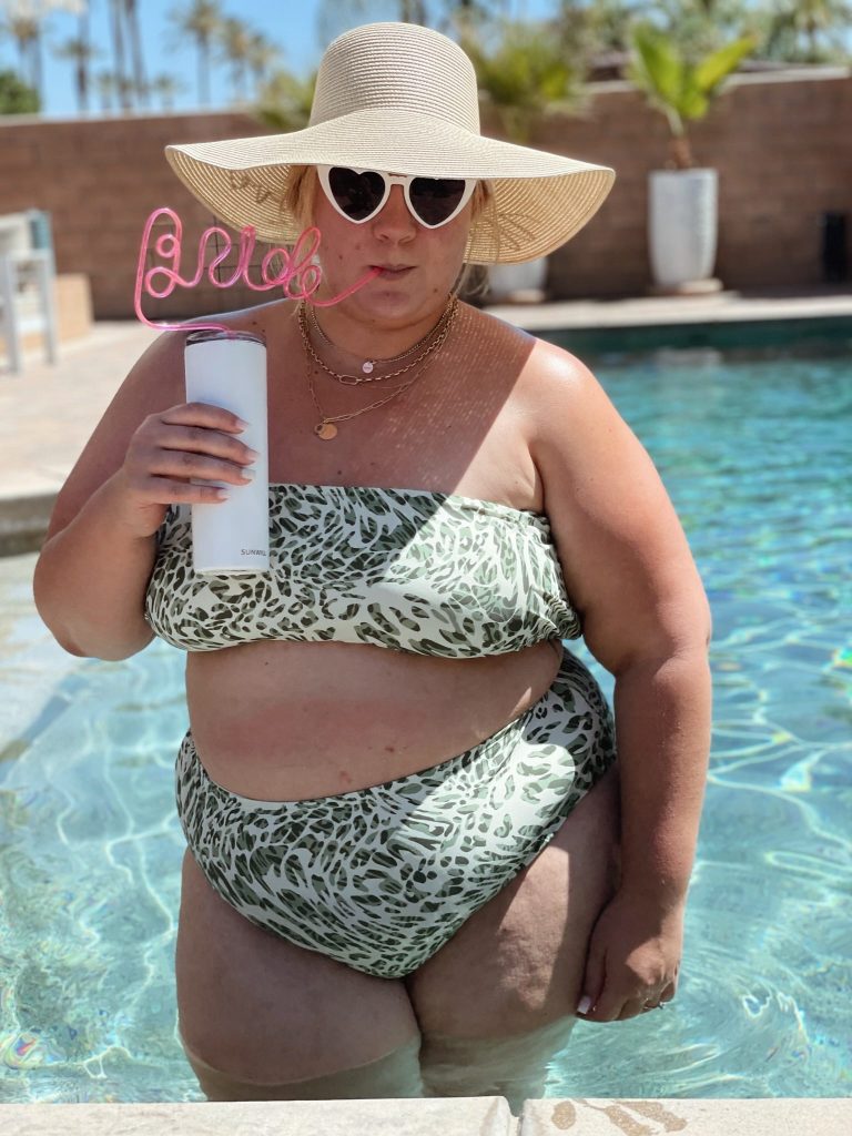 bride wears a floppy hat and bikini at her bachelorette party in palm springs