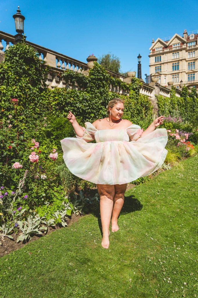 Gabbi plays with her dress in Parade Gardens