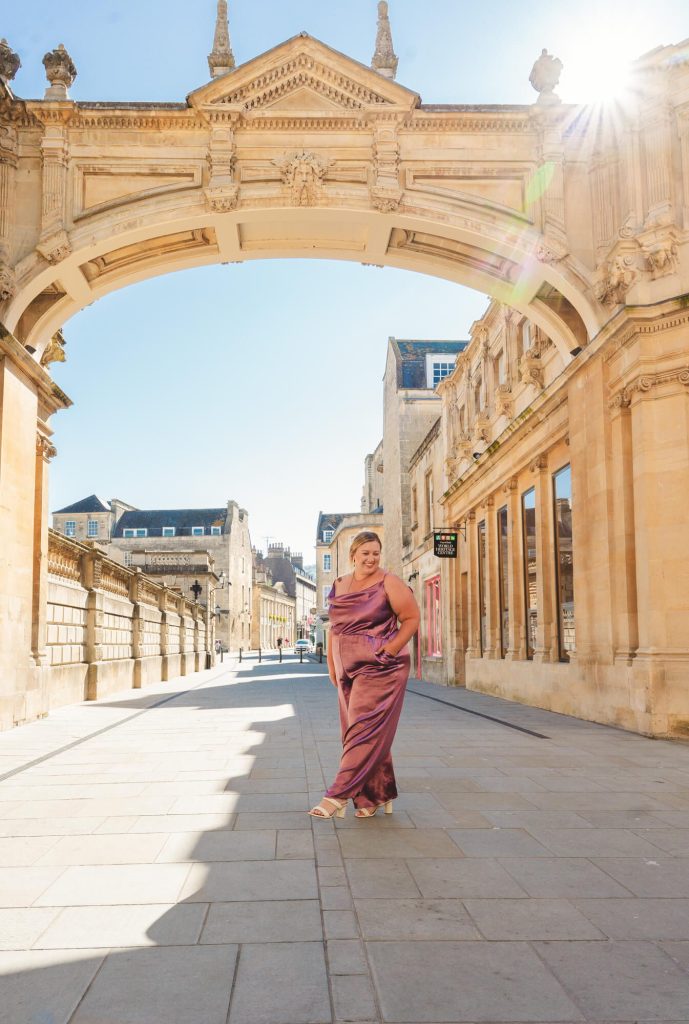 Gabbi walks beneath an archway near the Roman Baths