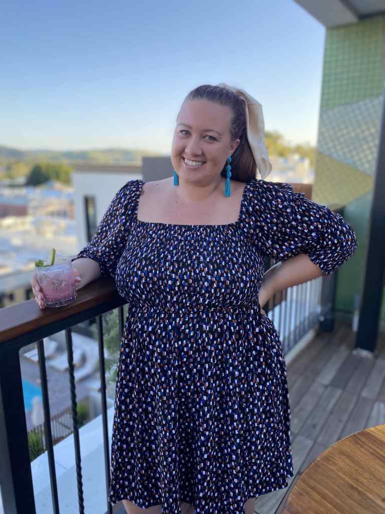 Posing with a cocktail at the hotel SLO high bar