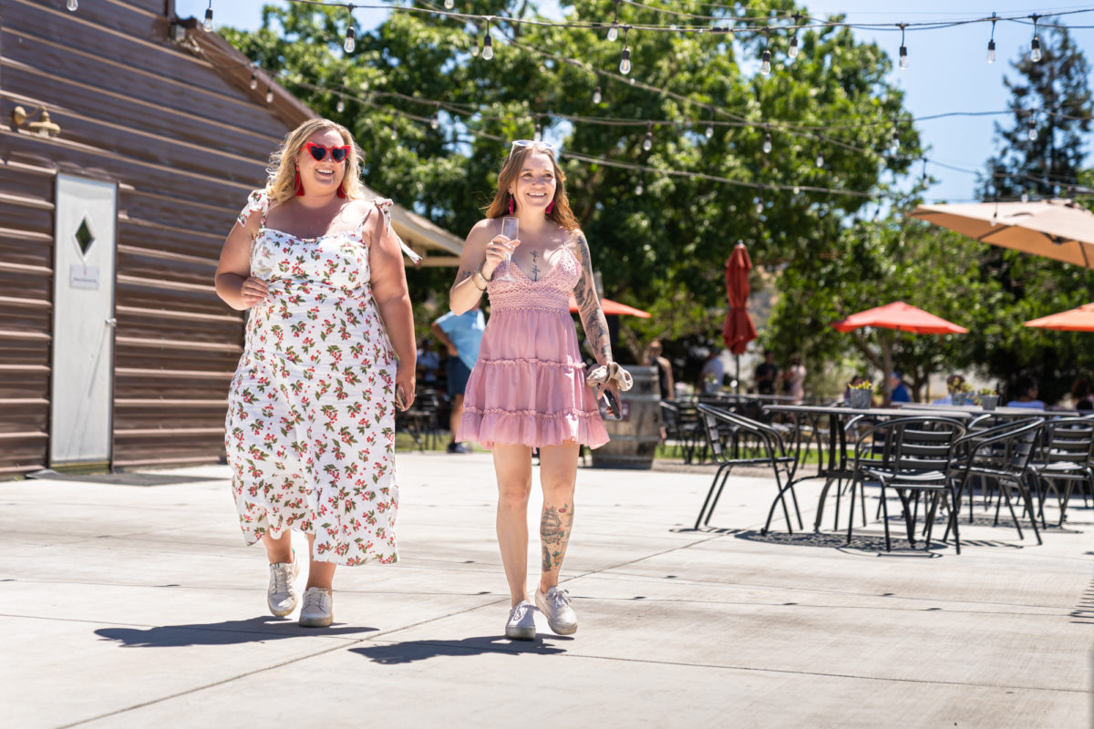 two women strolling around a Morgan Hill winery