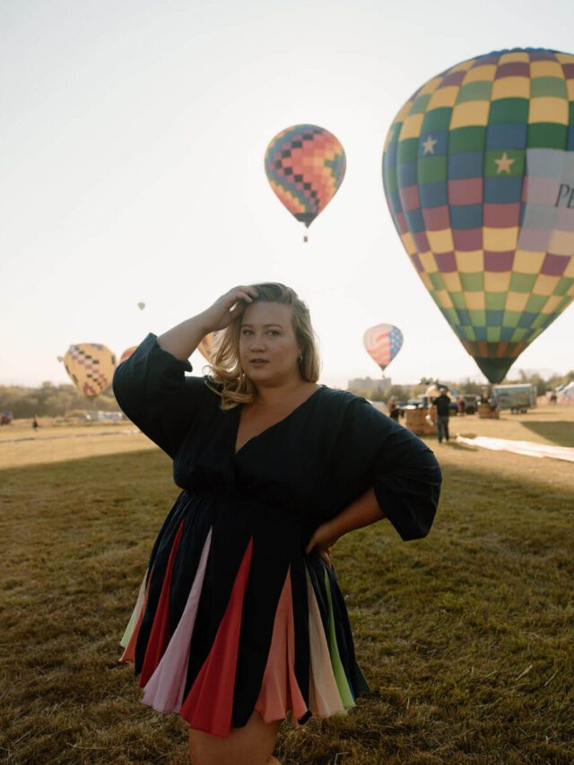 woman stands in the field at the Reno Hot Air Balloon Races